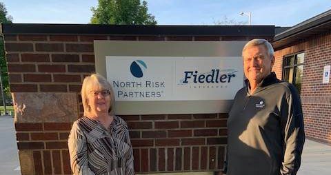 Jennifer and Scott Photo Outside of Office